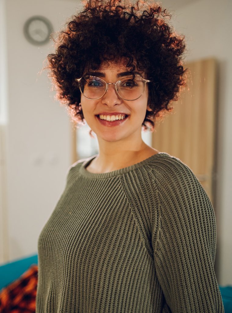 portrait-of-a-beautiful-caucasian-woman-with-afro-hairstyle-wearing-eyeglasses.jpg